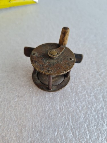 Teeny antique fishing reel - antique,