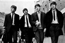 The Beatles early pose of the Fab Four walking down street