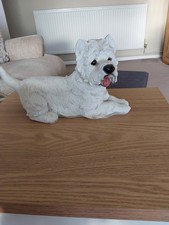 WESTIE LYING DOWN ORNAMENT.  RESIN.  USED BUT QUITE GOOD CONDITION.