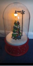 Large plastic snow dome with light, music and falling snow. Electric. 39cm high.