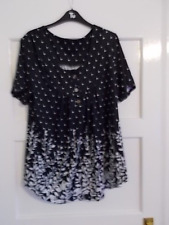 A Ladies Black with a White pattern Smock Top Size XL
