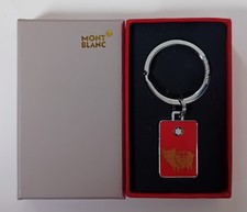 MONT BLANC KEYRING (YEAR OF PIG) TOTAL HEIGHT = 7CM (SUN DAMAGE + WEAR TO BOX)