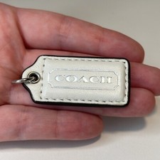 Mini Coach Purse Charm. White with Silver lettering.
