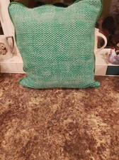 Luxuriously soft cushion woven from hand spun Merino yarn.  Velvet backing, zip.