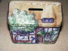 money box tin, thatched