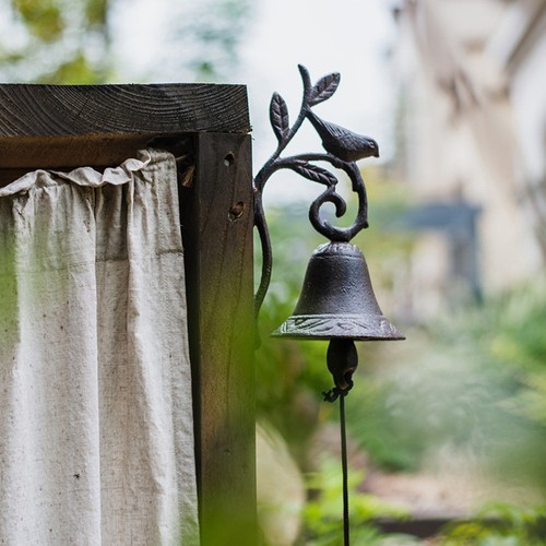 Brown cast iron doorbell - cast,