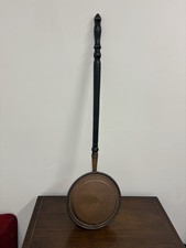 antique copper bed warmer, also known as a warming pan