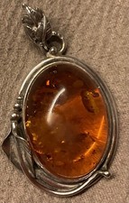Vintage Sterling Silver Pendant with a Baltic Amber Stone. Decorative leaf Motif