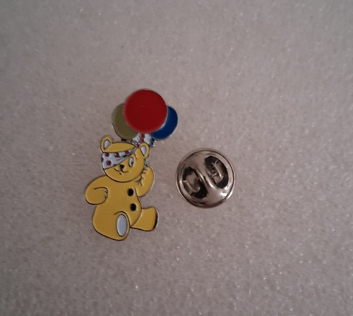 Pudsey bear holding - holding, balloons