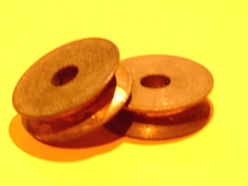Two meccano brass pulleys - two,