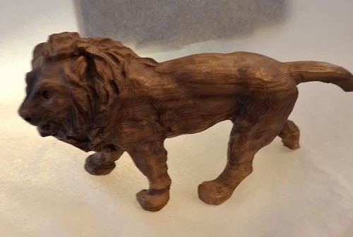 Hand carved lion - hand,