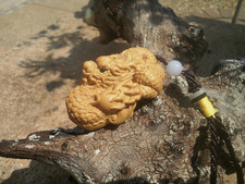 1a.  Carved wood netsuke Dragon curled up, with cord handle wood figure