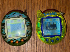 2 x Tamagotchi Both Working Green Camouflage camo & Transparent Bandai 2004