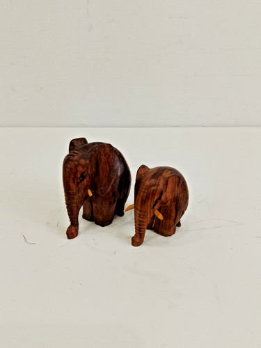 Pair artisan carved wooden - of,