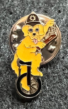 DOG ON UNI CYCLE POLICE HELMET TRUNCHEON HANDCUFFS PIN BADGE