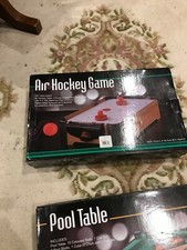 air hockey game  includes  2 pucks  2 discs and score card with table