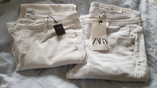 TWO PAIRS OF WHITE JEANS ZARA