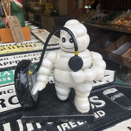 Michelin man inflating tyre - michelin,