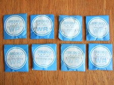 Lot of 8 Seiko new old stock watch glasses assorted
