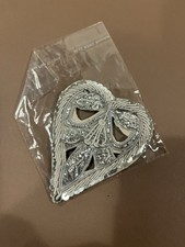 A Silver Sequin And Thread