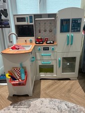 kids’ timber play kitchen set with various accessories.