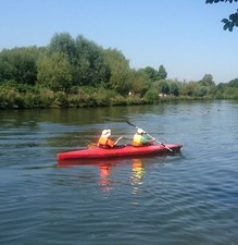 kayak: red 2-person fibre-glass canoe, needs a re-paint
