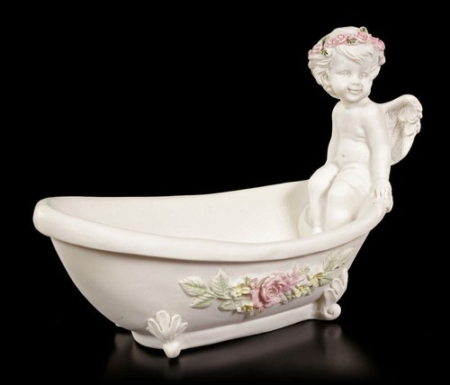 Angel figure sitting on - -,
