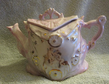 Antique Porcelain tea pot, 1900?  Cherubs.  No brand but has 5 x's. Good for age