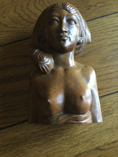 Klungkung Bali bust of a topless young lady.