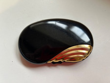 Elizabeth Arden powder compact.