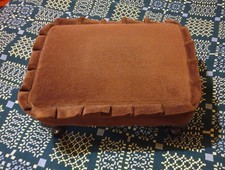 Small rectagular stool. Brown velvet. Wooden legs. 15in x 11.5in. 7in high.