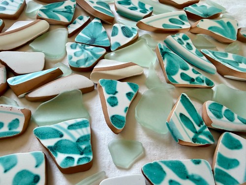 Broken tumbled pottery in - &,