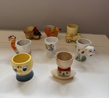 Collection Of 8 Vintage Egg Cups mid 20th C Japanese, Noah’s Ark, Sooty, Others