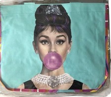 Audrey Hepburn Blowing A Pink