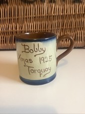 LOVELY ANTIQUE TORQUAY MOTO WARE CUP- BOBBY XMAS 1925