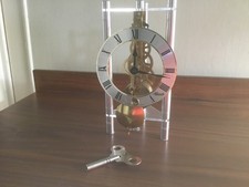 FRANZ HERMLE ~ Skeleton Triangular Table Clock - Silver /brass Roman dial