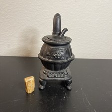VINTAGE 4 1/2" HIGH CAST IRON