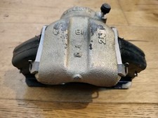 mazda RX3 1973 front brake caliper complete with pads new old stock
