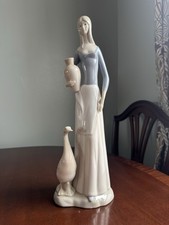 Woman holding vase with Duck,"