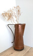 Antique copper jug with iron