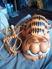 garfield phone vintage.laying down with eyes that open when in use 