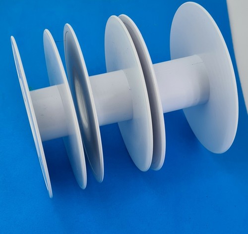 White empty ribbon spool reels - white,