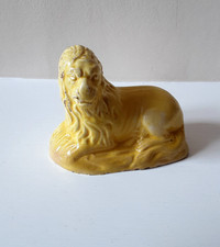 Rare 18th century staffordshire canary yellow figure of a recumbant lion .