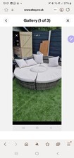 GREY RATTAN LOOK ROUND DAYBED. USED CONDITION.