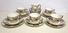 NORITAKE ART DECO HAND PAINTED AND GILDED 17 PIECE PART TEA SET.