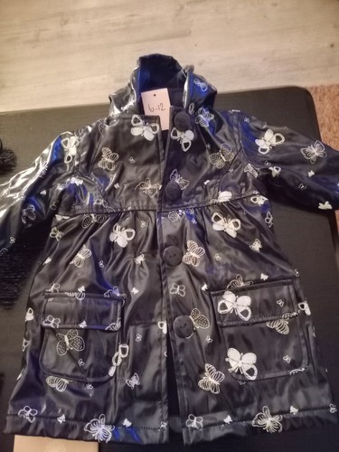 Two baby girls raincoats age - two,