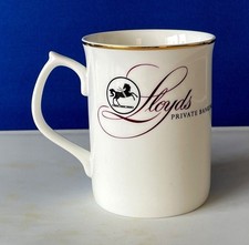LLOYDS BANK Ceramic Mug and 'Quentin' Figure. July Ceramic Products Mug 1980's?