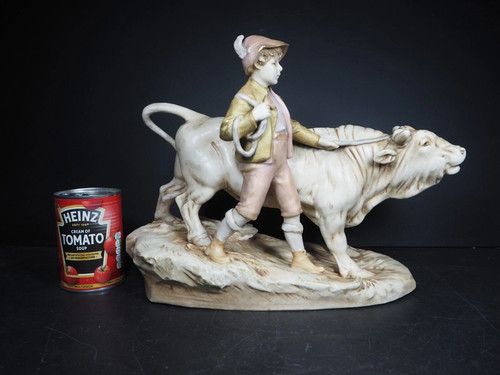Boy with bull figurine - bull,