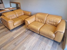 Two x  2 Seater orange Leather