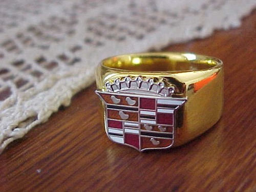 1950s cadillac crest logo gold - cadillac,